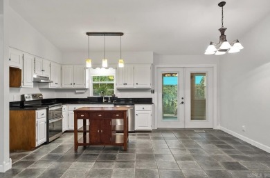 Peaceful Diamondhead Retreat with Golf Course Views  Sunroom on Diamondhead Golf and Country Club in Arkansas - for sale on GolfHomes.com, golf home, golf lot