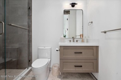 Stunning 4 bed, 4.5 bath Tributary Cabin with pond & Teton on Huntsman Springs Golf Club in Idaho - for sale on GolfHomes.com, golf home, golf lot