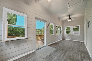Peaceful Diamondhead Retreat with Golf Course Views  Sunroom on Diamondhead Golf and Country Club in Arkansas - for sale on GolfHomes.com, golf home, golf lot