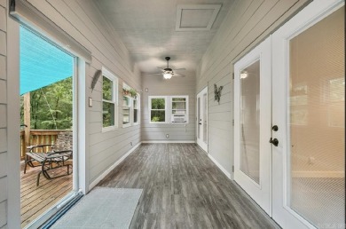 Peaceful Diamondhead Retreat with Golf Course Views  Sunroom on Diamondhead Golf and Country Club in Arkansas - for sale on GolfHomes.com, golf home, golf lot