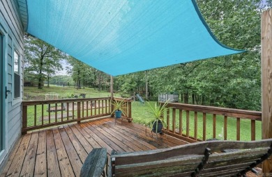 Peaceful Diamondhead Retreat with Golf Course Views  Sunroom on Diamondhead Golf and Country Club in Arkansas - for sale on GolfHomes.com, golf home, golf lot