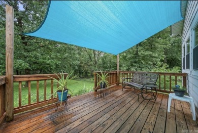 Peaceful Diamondhead Retreat with Golf Course Views  Sunroom on Diamondhead Golf and Country Club in Arkansas - for sale on GolfHomes.com, golf home, golf lot