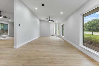 Welcome to 1208 W Red Bird Lane -- a fully renovated, corner-lot on The Golf Club of Dallas in Texas - for sale on GolfHomes.com, golf home, golf lot