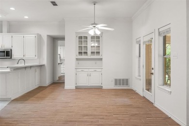This comfortable 3-2.5-2 home with golf cart space is tucked on Nutcracker Golf Club in Texas - for sale on GolfHomes.com, golf home, golf lot