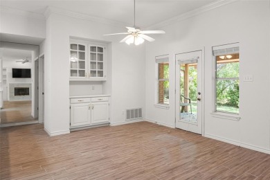 This comfortable 3-2.5-2 home with golf cart space is tucked on Nutcracker Golf Club in Texas - for sale on GolfHomes.com, golf home, golf lot