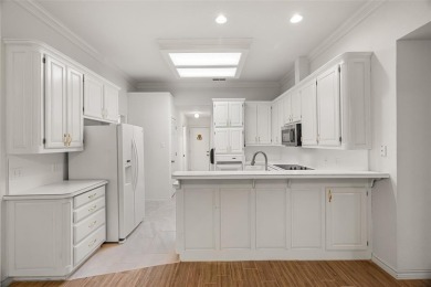 This comfortable 3-2.5-2 home with golf cart space is tucked on Nutcracker Golf Club in Texas - for sale on GolfHomes.com, golf home, golf lot