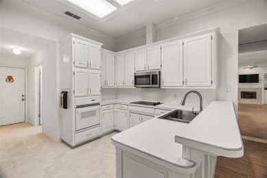 This comfortable 3-2.5-2 home with golf cart space is tucked on Nutcracker Golf Club in Texas - for sale on GolfHomes.com, golf home, golf lot