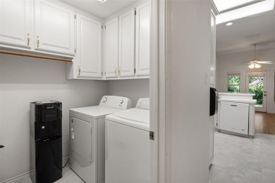 This comfortable 3-2.5-2 home with golf cart space is tucked on Nutcracker Golf Club in Texas - for sale on GolfHomes.com, golf home, golf lot