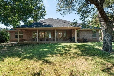 This comfortable 3-2.5-2 home with golf cart space is tucked on Nutcracker Golf Club in Texas - for sale on GolfHomes.com, golf home, golf lot