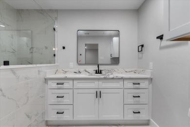 Welcome to 1208 W Red Bird Lane -- a fully renovated, corner-lot on The Golf Club of Dallas in Texas - for sale on GolfHomes.com, golf home, golf lot