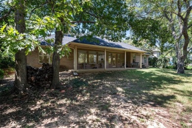 This comfortable 3-2.5-2 home with golf cart space is tucked on Nutcracker Golf Club in Texas - for sale on GolfHomes.com, golf home, golf lot