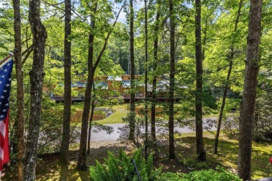 Nestled at the end of a quiet cul-de-sac in The Woods, this on The Country Club of Sapphire Valley in North Carolina - for sale on GolfHomes.com, golf home, golf lot