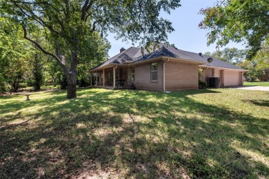 This comfortable 3-2.5-2 home with golf cart space is tucked on Nutcracker Golf Club in Texas - for sale on GolfHomes.com, golf home, golf lot