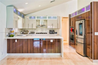 Cathedral Ceiling Single family Home for Sale located in the on Woodmont Country Club in Florida - for sale on GolfHomes.com, golf home, golf lot