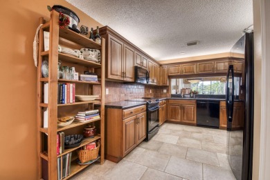 This charming 3-bedroom, 2.5-bathroom home with a tastefully on PGA National Golf Club in Florida - for sale on GolfHomes.com, golf home, golf lot