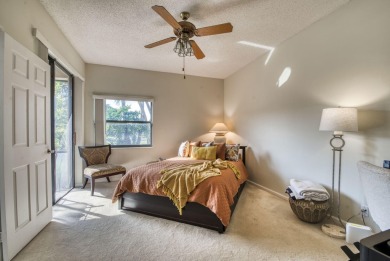 This charming 3-bedroom, 2.5-bathroom home with a tastefully on PGA National Golf Club in Florida - for sale on GolfHomes.com, golf home, golf lot