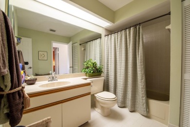 This charming 3-bedroom, 2.5-bathroom home with a tastefully on PGA National Golf Club in Florida - for sale on GolfHomes.com, golf home, golf lot