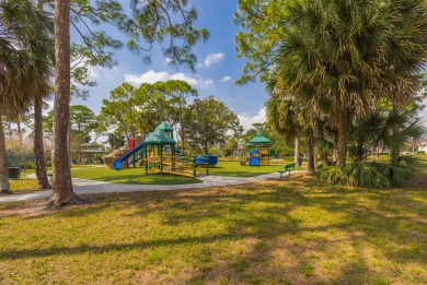 This charming 3-bedroom, 2.5-bathroom home with a tastefully on PGA National Golf Club in Florida - for sale on GolfHomes.com, golf home, golf lot