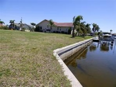 This beautiful Punta Gorda Isles gulf access waterfront lot with on Saint Andrews South Golf Club in Florida - for sale on GolfHomes.com, golf home, golf lot