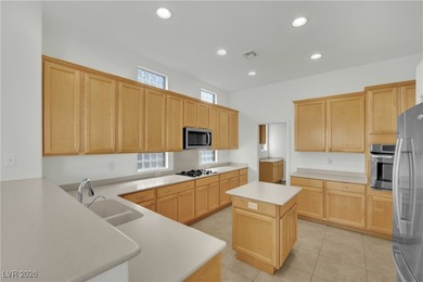 Single-story home in Sun City MacDonald Ranch, a 55+ Henderson on Desert Willow Golf Course in Nevada - for sale on GolfHomes.com, golf home, golf lot