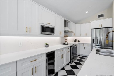 This 3BD, 2.5BA CBS pool home in Palm City is anything but on Evergreen Club in Florida - for sale on GolfHomes.com, golf home, golf lot