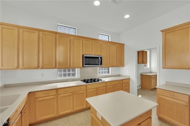 Single-story home in Sun City MacDonald Ranch, a 55+ Henderson on Desert Willow Golf Course in Nevada - for sale on GolfHomes.com, golf home, golf lot