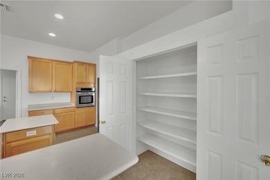 Single-story home in Sun City MacDonald Ranch, a 55+ Henderson on Desert Willow Golf Course in Nevada - for sale on GolfHomes.com, golf home, golf lot