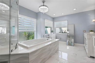 This 3BD, 2.5BA CBS pool home in Palm City is anything but on Evergreen Club in Florida - for sale on GolfHomes.com, golf home, golf lot