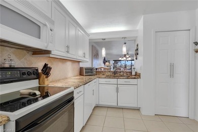 This desirable first floor condo has stunning lake views from on Riviera Golf Club in Florida - for sale on GolfHomes.com, golf home, golf lot