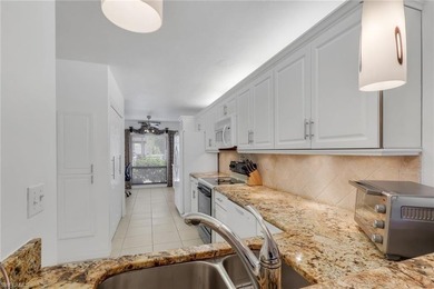 This desirable first floor condo has stunning lake views from on Riviera Golf Club in Florida - for sale on GolfHomes.com, golf home, golf lot