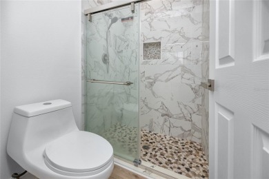 Welcome to Balintore, a charming and secluded single-family home on Lansbrook Golf Club in Florida - for sale on GolfHomes.com, golf home, golf lot