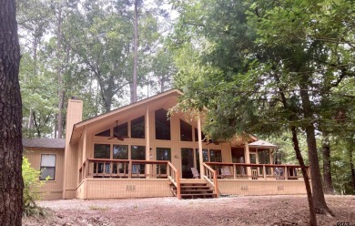 Situated on a hill, this one owner, two lot home allows for the on Holly Lake Ranch Golf Club in Texas - for sale on GolfHomes.com, golf home, golf lot