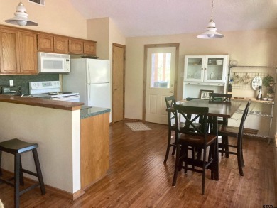 Situated on a hill, this one owner, two lot home allows for the on Holly Lake Ranch Golf Club in Texas - for sale on GolfHomes.com, golf home, golf lot