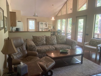 Situated on a hill, this one owner, two lot home allows for the on Holly Lake Ranch Golf Club in Texas - for sale on GolfHomes.com, golf home, golf lot