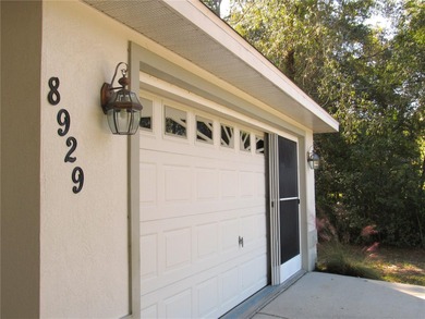 Charming three-bedroom, two-bathroom home featuring a two-car on Citrus Springs Country Club in Florida - for sale on GolfHomes.com, golf home, golf lot