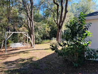 Charming three-bedroom, two-bathroom home featuring a two-car on Citrus Springs Country Club in Florida - for sale on GolfHomes.com, golf home, golf lot