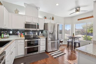 This beautifully remodeled Willow floor plan features walnut on Sun City Grand Golf Couse and Club in Arizona - for sale on GolfHomes.com, golf home, golf lot