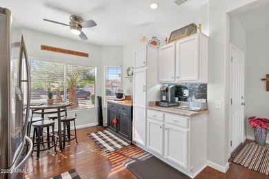 This beautifully remodeled Willow floor plan features walnut on Sun City Grand Golf Couse and Club in Arizona - for sale on GolfHomes.com, golf home, golf lot