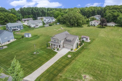 Welcome to your dream home in a desirable neighborhood of newer on Hankerd Hills Golf Course in Michigan - for sale on GolfHomes.com, golf home, golf lot