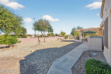 This beautifully remodeled Willow floor plan features walnut on Sun City Grand Golf Couse and Club in Arizona - for sale on GolfHomes.com, golf home, golf lot