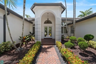 Stunning Luxury waterfront pool home in exclusive Weston Hills on Weston Hills Country Club in Florida - for sale on GolfHomes.com, golf home, golf lot