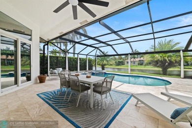 Stunning Luxury waterfront pool home in exclusive Weston Hills on Weston Hills Country Club in Florida - for sale on GolfHomes.com, golf home, golf lot