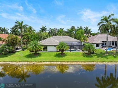 Stunning Luxury waterfront pool home in exclusive Weston Hills on Weston Hills Country Club in Florida - for sale on GolfHomes.com, golf home, golf lot