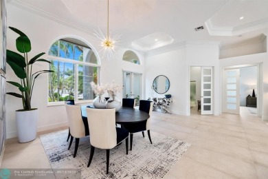 Stunning Luxury waterfront pool home in exclusive Weston Hills on Weston Hills Country Club in Florida - for sale on GolfHomes.com, golf home, golf lot
