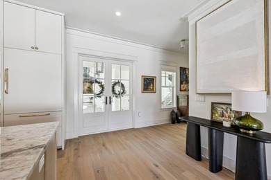 This Stunning 5-bedroom, 5.5-bath luxury residence overlooks the on Origins Golf Club in Florida - for sale on GolfHomes.com, golf home, golf lot