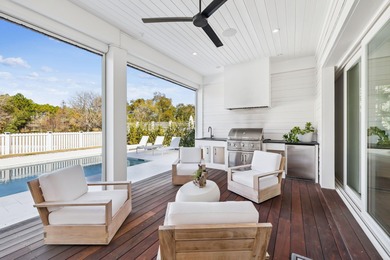 This Stunning 5-bedroom, 5.5-bath luxury residence overlooks the on Origins Golf Club in Florida - for sale on GolfHomes.com, golf home, golf lot