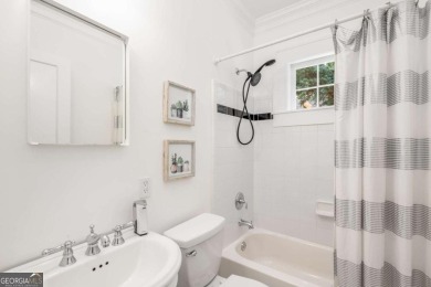 This 3-bedroom, 2-bath brick bungalow blends timeless character on College Park Municipal Golf Course in Georgia - for sale on GolfHomes.com, golf home, golf lot