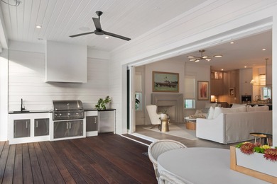 This Stunning 5-bedroom, 5.5-bath luxury residence overlooks the on Origins Golf Club in Florida - for sale on GolfHomes.com, golf home, golf lot