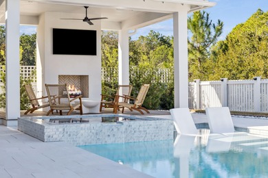 This Stunning 5-bedroom, 5.5-bath luxury residence overlooks the on Origins Golf Club in Florida - for sale on GolfHomes.com, golf home, golf lot