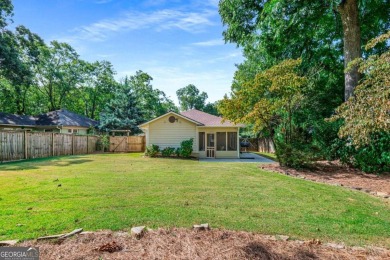 This 3-bedroom, 2-bath brick bungalow blends timeless character on College Park Municipal Golf Course in Georgia - for sale on GolfHomes.com, golf home, golf lot